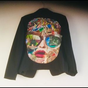 Jacket with canvas appliqué in the back. Size 16.